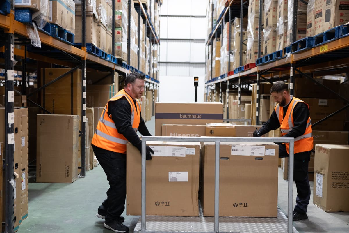 Warehouse-operative-loadning-items-carriage-van.jpg