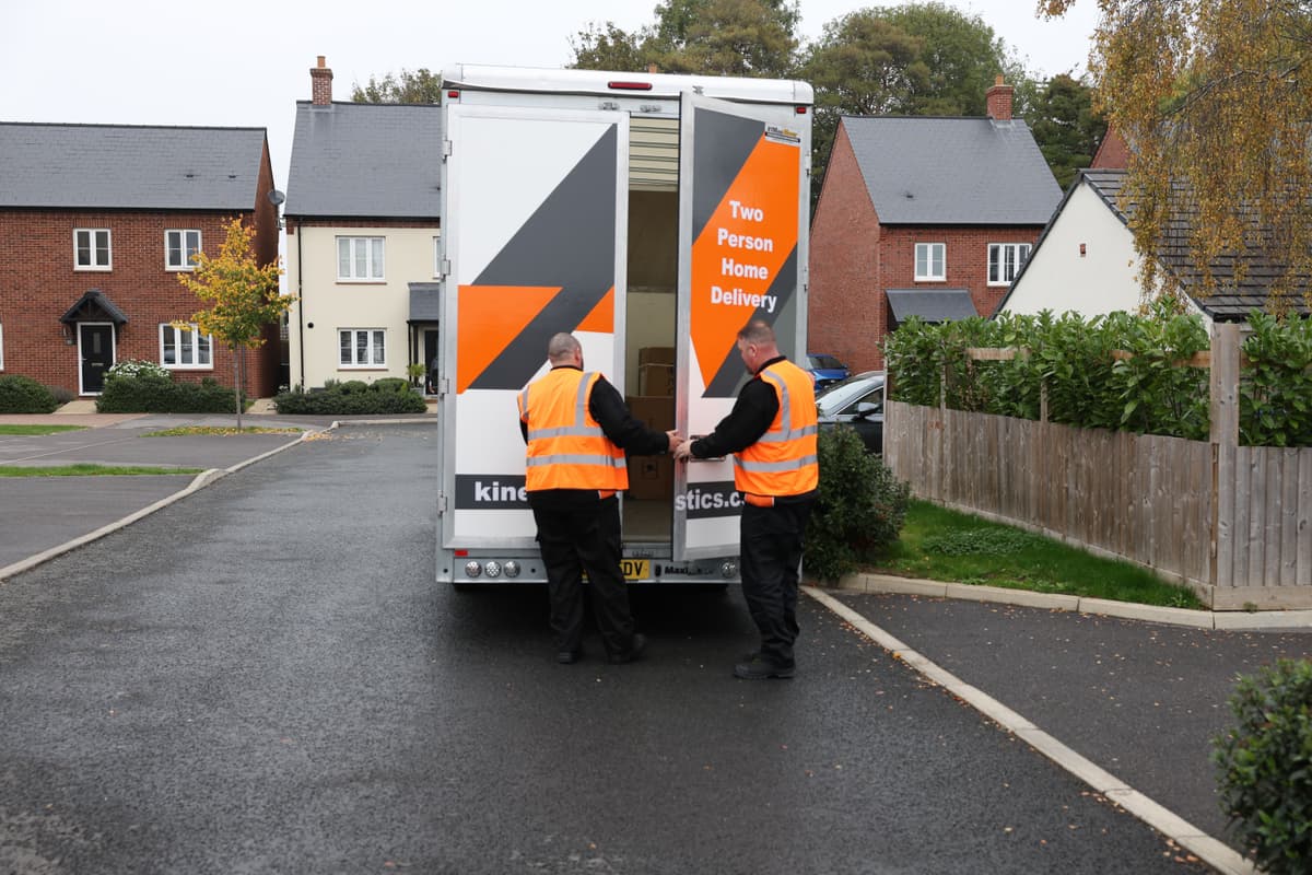 kinetic-delivery-drivers-delivering-furniture-to-a-customer-house.png
